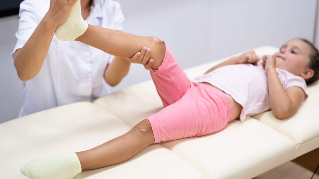 Child getting adjusted by chiropractor
