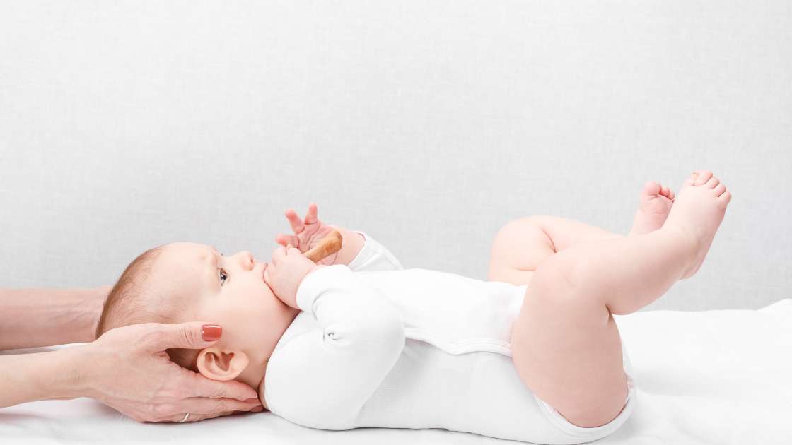 Baby getting adjusted by chiropractor